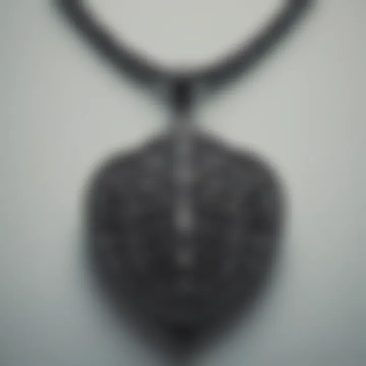 Close-up of intricate design details of a black spade necklace