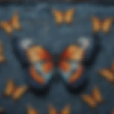 Close-up of butterfly print design on denim fabric