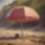 A sturdy beach umbrella holder securing an umbrella in sandy terrain