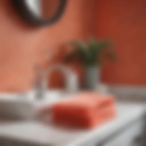 Elegant coral washcloth draped over a stylish bathroom sink