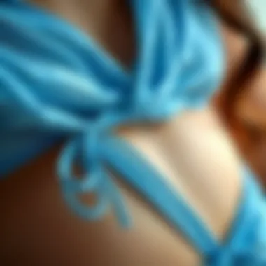 Close-up of fabric texture and color of a blue bikini top