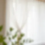 Elegant white sheer curtain panels draping gracefully over a window