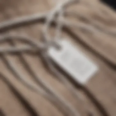 Close-up of a cord tag attached to a stylish garment, highlighting its aesthetic appeal